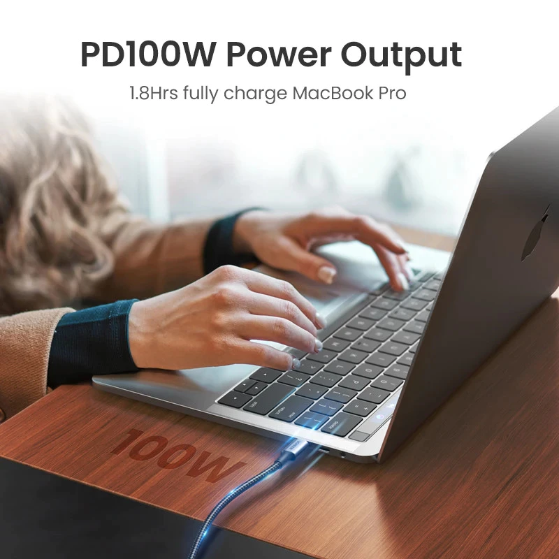 UGREEN 100W cable charging a MacBook