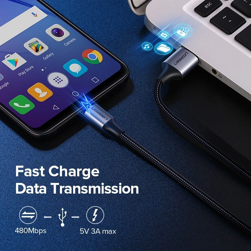 Micro USB cable connected between phone and laptop