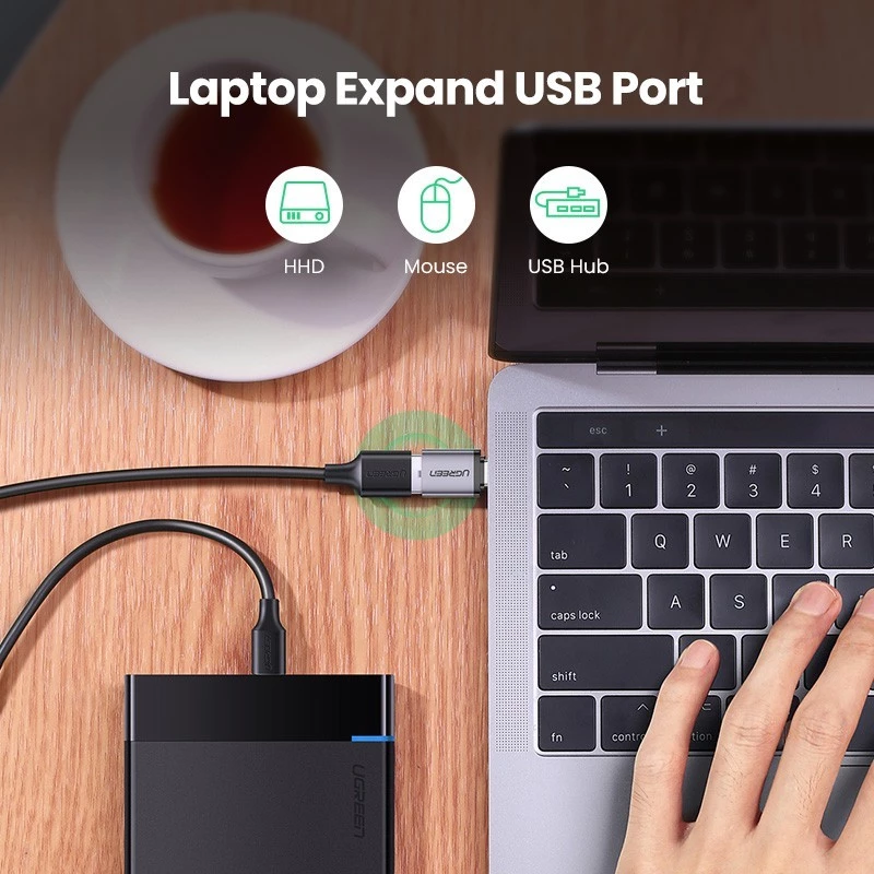 USB-C laptop with adapter and USB accessory